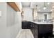 Modern basement bar with dark cabinetry and granite countertops at 29775 E 162Nd Ave, Brighton, CO 80603