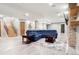 Finished basement with large sectional sofa and stone fireplace at 29775 E 162Nd Ave, Brighton, CO 80603