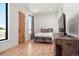 Bright bedroom with wood floors and large window at 29775 E 162Nd Ave, Brighton, CO 80603