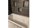 Clean bathroom with a jetted bathtub and tile surround at 2792 S Macon Cir, Aurora, CO 80014