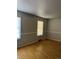 Simple bedroom with hardwood floors and neutral walls at 2792 S Macon Cir, Aurora, CO 80014