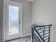 Second-floor entryway with frosted glass door and staircase at 4364 W 29Th Ave, Denver, CO 80212