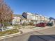 Townhouse exterior with light beige siding, and a small front yard at 5888 Biscay St # D, Denver, CO 80249