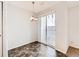 Bright dining area with sliding glass door and neutral decor at 5888 Biscay St # D, Denver, CO 80249