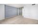 Spacious bedroom with light walls, carpeting and mirrored closet doors at 1020 15Th St # 7A, Denver, CO 80202