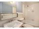 Clean bathroom with white tile and a bathtub shower combo at 1020 15Th St # 7A, Denver, CO 80202