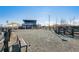 Fenced dog park with a shaded seating area at 60 S Trussville St, Aurora, CO 80018