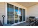 Backyard patio with sliding glass doors and grill at 60 S Trussville St, Aurora, CO 80018