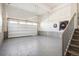 Finished garage with epoxy floor and staircase at 60 S Trussville St, Aurora, CO 80018