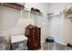 Large walk-in closet with shelving and additional storage at 60 S Trussville St, Aurora, CO 80018