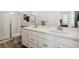 Clean bathroom with double vanity, shower, and toilet at 60 S Trussville St, Aurora, CO 80018
