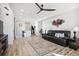 Spacious living room with hardwood floors and open concept design at 60 S Trussville St, Aurora, CO 80018