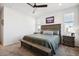 Spacious primary bedroom with large bed, nightstands, and window at 60 S Trussville St, Aurora, CO 80018