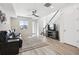 Open concept living room with hardwood floors and modern decor at 60 S Trussville St, Aurora, CO 80018