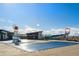 Community pool with a water playground and covered seating at 60 S Trussville St, Aurora, CO 80018