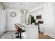 Modern kitchen with white cabinets, stainless steel appliances, and island at 60 S Trussville St, Aurora, CO 80018