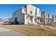 Modern two-story home with attached two-car garage and landscaped yard at 60 S Trussville St, Aurora, CO 80018