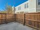 Private backyard with wooden fence at 1050 S Monaco Pkwy # 106, Denver, CO 80224