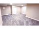 Unfinished basement with gray carpet and plenty of potential at 1786 W 66Th Ave, Denver, CO 80221