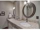 Bathroom with double sinks, granite countertop, and large mirror at 45 Kerrigan Ct, Breckenridge, CO 80424