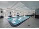 Indoor swimming pool with tiled floor and seating at 1441 N Humboldt St # 504, Denver, CO 80218