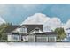 Farmhouse-style home with a three-car garage and stone detailing at 6521 S Harlan Ct, Littleton, CO 80123