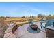 Relaxing backyard patio with fire pit and seating at 10789 Troy St, Commerce City, CO 80022