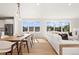 Open concept dining area with hardwood floors and a view at 1330 W 35Th Ave, Denver, CO 80211