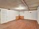 Unfinished basement with hardwood floors and a wet bar at 155 N Downing St, Denver, CO 80218