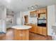 Kitchen features wood cabinets, tile countertops and an island at 155 N Downing St, Denver, CO 80218
