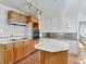Kitchen boasts wood cabinets, tile countertops and island at 155 N Downing St, Denver, CO 80218