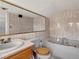 Clean bathroom with a large bathtub and updated vanity at 155 N Downing St, Denver, CO 80218