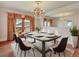 Elegant dining room with a chandelier and modern dining set at 155 N Downing St, Denver, CO 80218