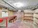 Partially finished basement with workbench and shelving at 155 N Downing St, Denver, CO 80218