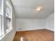 Simple bedroom featuring hardwood floors and a window at 155 N Downing St, Denver, CO 80218