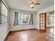 Bedroom with hardwood floors, window, and french doors at 155 N Downing St, Denver, CO 80218