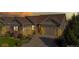 Aerial view of a home at dusk with gray exterior and landscaping at 4111 W 149Th Ave, Broomfield, CO 80023