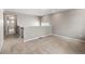 Spacious loft area with carpeted flooring and hallway access at 16591 W 93Rd Ave, Arvada, CO 80007