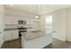 Modern kitchen with granite countertops and island at 6542 12Th St, Frederick, CO 80530