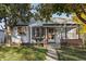 Charming light blue house with brick accents and a manicured lawn at 1340 Xanthia St, Denver, CO 80220