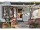 Inviting front porch with brick accents and bay window at 1340 Xanthia St, Denver, CO 80220