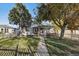 Charming single story home with a well-manicured lawn at 1340 Xanthia St, Denver, CO 80220