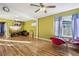 Living room with wood floors, and red accent chairs at 1340 Xanthia St, Denver, CO 80220