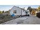 Rear view of the home with a large backyard at 1340 Xanthia St, Denver, CO 80220
