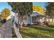 Charming one-story home with front yard and white picket fence at 1340 Xanthia St, Denver, CO 80220
