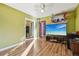 Spacious bedroom with wood floors and large TV at 1340 Xanthia St, Denver, CO 80220