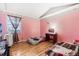 Bright bedroom with wood flooring and ample natural light at 1340 Xanthia St, Denver, CO 80220