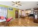 Open living room and kitchen with wood floors at 1340 Xanthia St, Denver, CO 80220