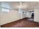 Unfinished basement with carpeted floor and ample space at 3637 Lowell Blvd, Denver, CO 80211