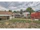 Large backyard with grassy area and mature trees at 3637 Lowell Blvd, Denver, CO 80211